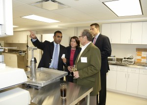 Dr. Paul Sethi with guests at grand opening of lab.