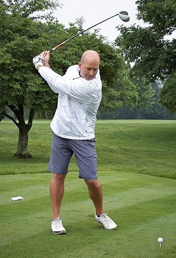Tim Hasselbeck teeing off